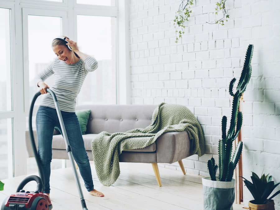 Cleaner vacuuming a living room