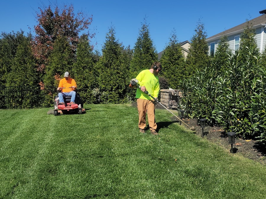 Landscaper mowing a lawn